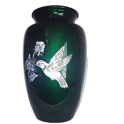green urn with hummingbird