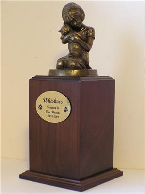 Walnut urn with Little girl bronze statue holding cat