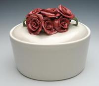 White ceramic cremation urn with roses