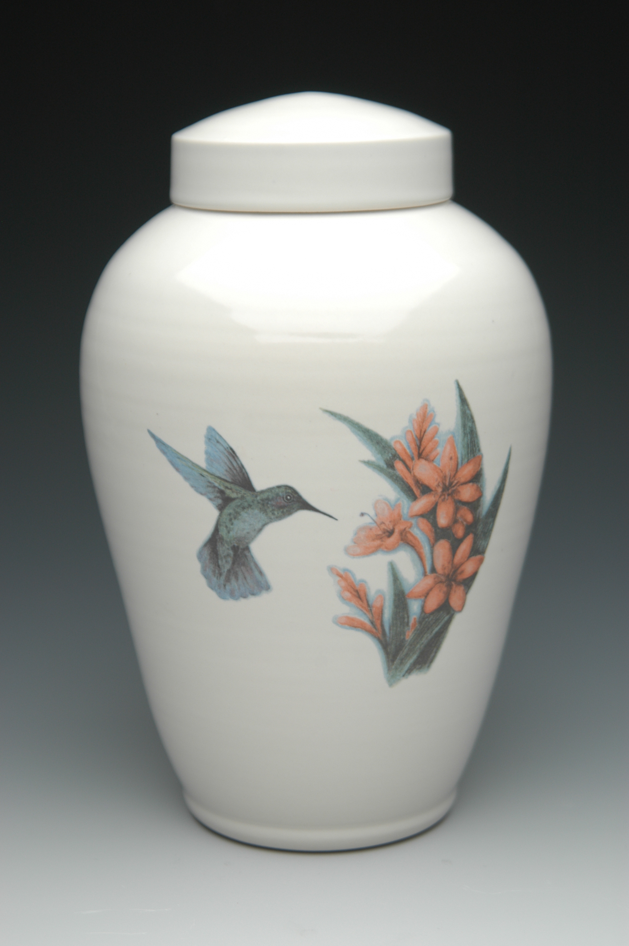 white ceramic urn with hand painted flowers and humming bird